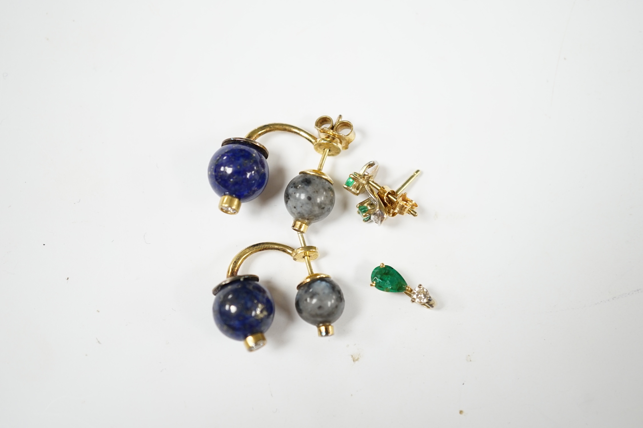 A modern small pair of yellow metal, emerald and diamond set ear studs, a similar pendant and a pair of lapis lazuli, hardstone and diamond chip set ear studs. Condition - fair